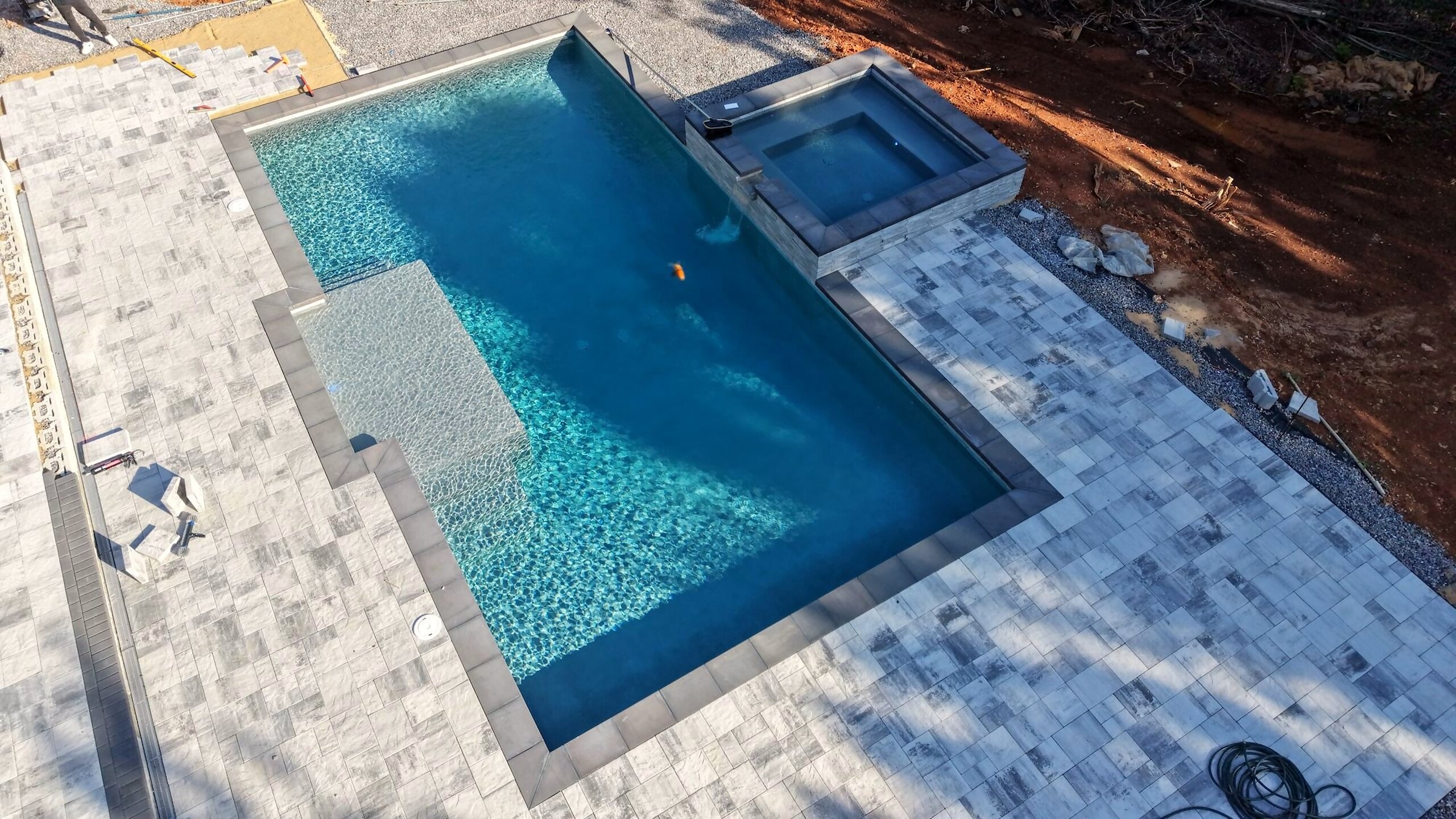 Aerial view of a finished custom pool and spa